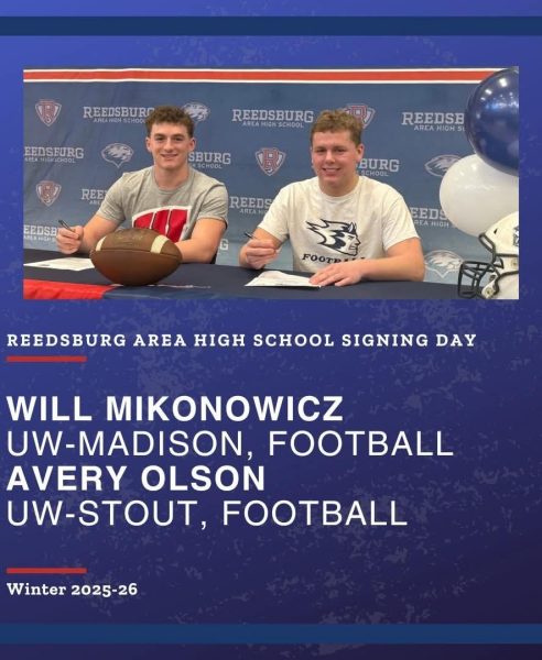Will and Avery in the RAHS commons signing their acceptance to UW Madison, and UW Stout.